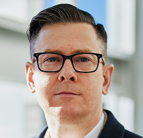 Alexander Hughes, CEO firmy handlującej kryptowalutami, portret dyrektora